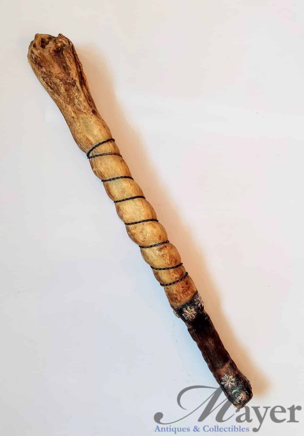 Antique Oosik walrus penis bone ceremonial club made by the Inuit Eskimo people of Alaska.