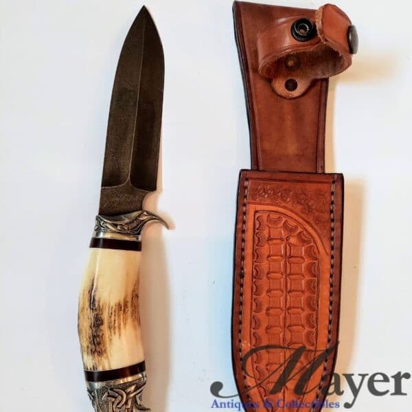 Eagle head knife with Jerry Fisk marked Damascus blade and leather scabbard signed by Alex Shamgar.